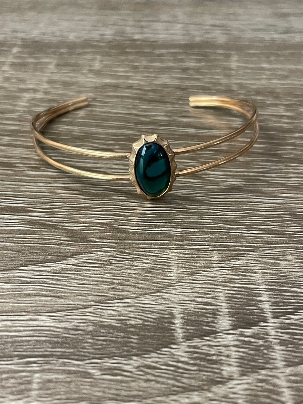 Gold-Tone Cuff Bracelet with Emerald Green Stone